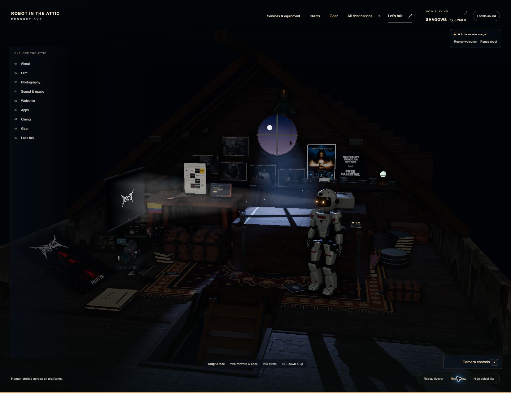 The Robot in the Attic Productions website showing the moonlit 3D attic, robot, projection screen, and interactive objects